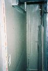 Drywall corner behind furnace