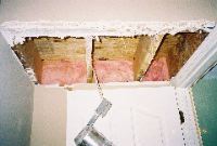 Tearing apart ceiling above stairs